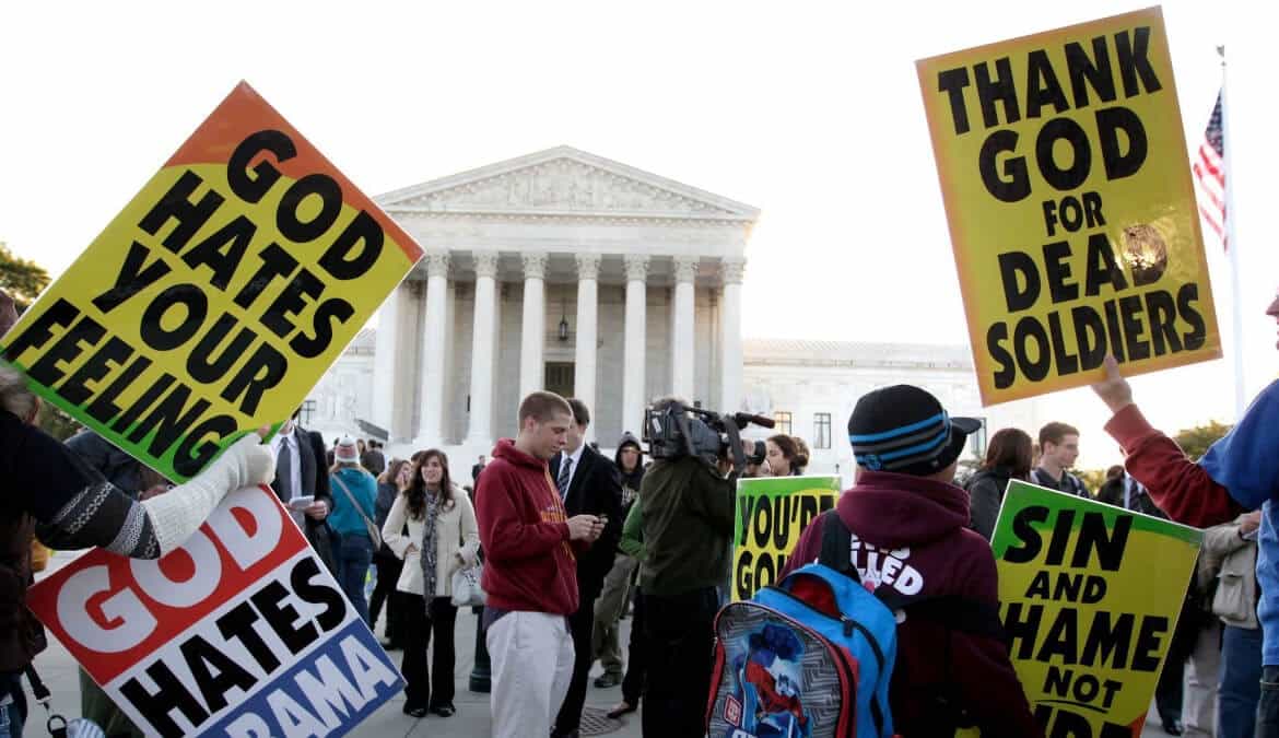 Members of the Westboro Baptist Church picket in front of the Supreme Court